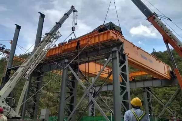 A 300t hydropower bridge crane powered by Weihua had delivered to Honduras. It is made for China Construction Group International Project for Honduras Patuka Ⅲ hydropower station construction. This bridge crane is mainly for the lifting of the hydropower generators and turbines.  The project is the first large-scale hydropower project in Honduras in the past 30 years. This bridge crane is designed with low headroom, lightweight, small wheel pressure, and there is safety brakes at reel drum tail. At present, the crane has been carried out installation and commissioning. Now it is preparing for the load test and acceptance work..jpg